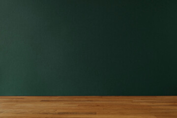 Dark bottle green background for copy space and wooden table