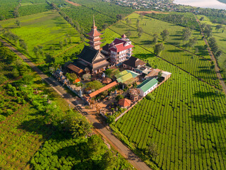 Aerial view of Buu Minh pagoda near Pleiku city, Gia Lai province, Vietnam. Morning views of pagoda and tea fields