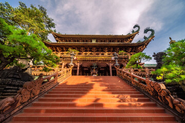 view of Minh Thanh pagoda, a majestic Buddhist architectural structure in Pleiku city, Gia Lai province, Vietnam, text in photo mean peace, compassion, forgiveness. Travel concept