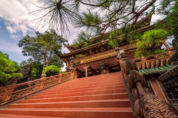 view of Minh Thanh pagoda, a majestic Buddhist architectural structure in Pleiku city, Gia Lai province, Vietnam, text in photo mean peace, compassion, forgiveness. Travel concept