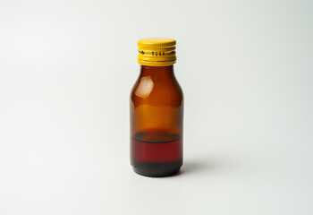 health concept, medicine and medicine - medicine bottle or syrup and antipyretic spoon