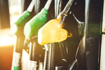Petrol pump filling nozzles at Gas station, close up view