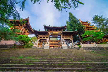 view of Minh Thanh pagoda, a majestic Buddhist architectural structure in Pleiku city, Gia Lai province, Vietnam, text in photo mean peace, compassion, forgiveness. Travel concept