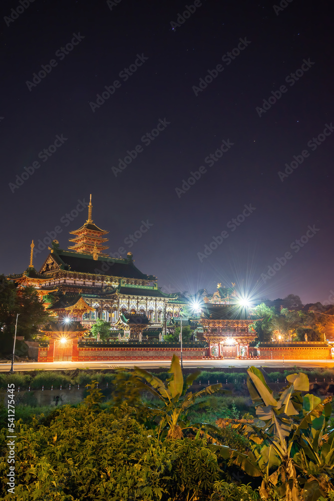 Wall mural view of Minh Thanh pagoda, a majestic Buddhist architectural structure in Pleiku city, Gia Lai province, Vietnam, text in photo mean peace, compassion, forgiveness. Travel concept