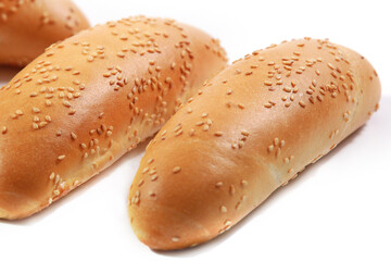 Bread baguettes with sesame seeds isolated on white background, white rustic Bakery food concept. Industrial baking bread made from white flour. Freshly organic baked bread