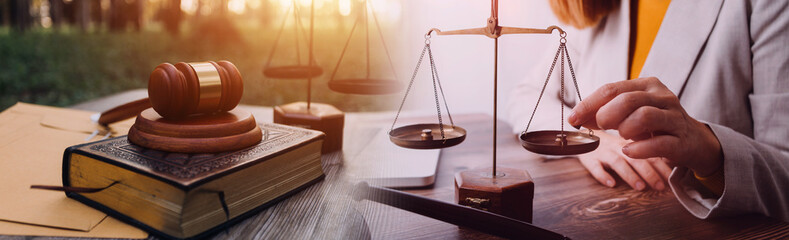 Business and lawyers discussing contract papers with brass scale on desk in office. Law, legal...