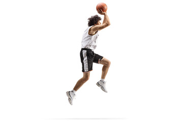Full length shot of a basketball player up in the air shooting a ball