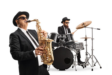 Man playing a saxophone and a drummer performing