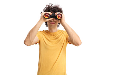 Guy looking through binoculars
