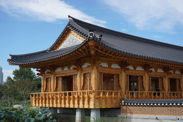Hanok with blue sky and trees