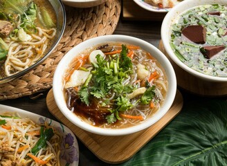 Hot rice noodle soup served in dish isolated on table side view of taiwan food