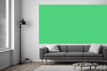 Canvas on the wall in a room with a black sofa, wooden parquet floor, white and gray color of the room, apartment without furniture. Layout for 3d rendering of the design.