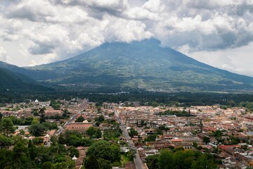 Town on the valley of volcano Agua with astonishing cloudscape