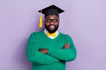 Photo of good looking intelligent student graduate university wear headwear isolated on violet...