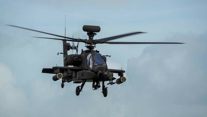 close-up front quarter view of ZM707 British army Boeing Apache Attack helicopter (AH-64E ArmyAir606) in low level flight 