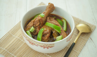 Delicious spicy chicken with soy sauce and paprica in selective focus