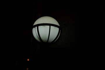 Lamp on street. Light in city. Round light source.