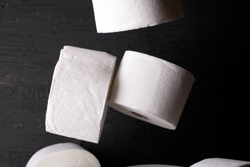 white toilet paper on a black background