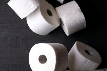 white toilet paper on a black background