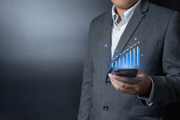 Close up businessman pushing, touching on smartphone with virtual emotion icon on black and gray background