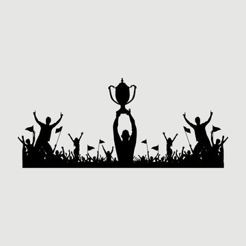 silhouette of a group of people lifting a trophy after winning the championship