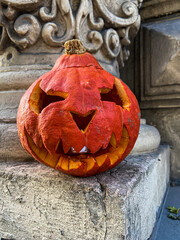 Jack-o'-lantern carved pumpkin with ghoulish face. Halloween tradition