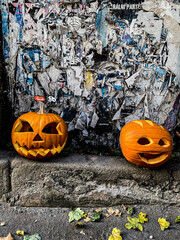 Halloween Jack-o'-lantern carved pumpkins with ghoulish faces.