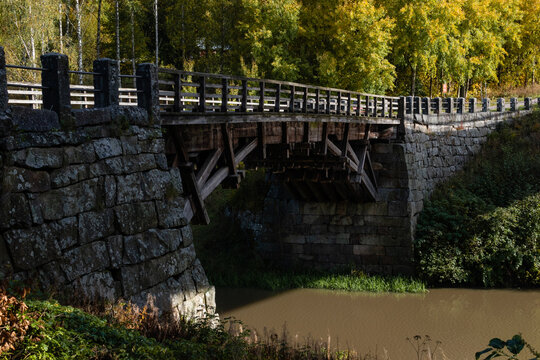 Halikko Old Bridge, built in 1866. Historic museum bridge in Salo, Finland with trees in autumn colors