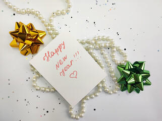 Postcard with the inscription "Happy New Year" with ribbons and a garland..Christmas background, border, card
