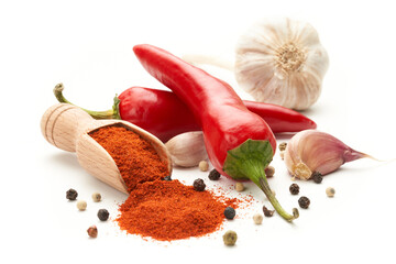 Hot red pepper ground on a white background. Whole hot peppers