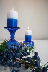 candles and decorations, blues and whites, holiday feeling.