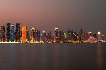 Naklejka premium Doha, Qatar- December 23,2019 : Night view of Skyline, Doha's Financial District (West Bay).
