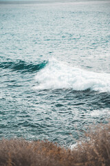 Ocean, sea with cliffs, waves in the sea, coastline, summertime, beach landscape