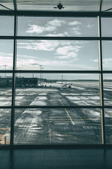 Airport through the window, dramatic landscape