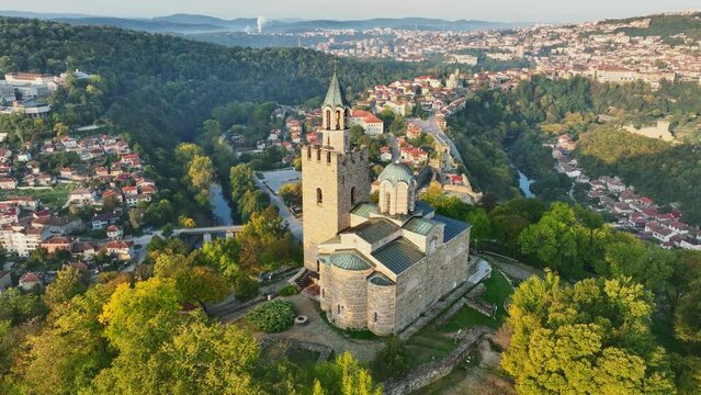 Flying around Ascension Cathedral on the mountain in Veliko Tarnovo, Bulgaria. Aerial morning shot of Veliko Tarnovo town