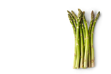 Fresh green asparagus isolated on white background. Top view, copy space, space for text.