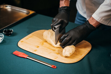 chef prepares hamburger buns,preparation for baking