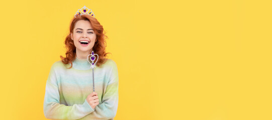 Woman isolated face portrait, banner with copy space. true emotions. happy redhead woman in crown. queen hold magic wand. arrogant princess in tiara.