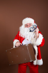 Vacation and holidays. Funny fat santa claus is resting on the sea.