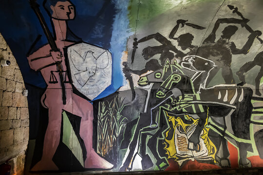 National Picasso Museum: ”War and Peace” by Picasso in the Chateau de Vallauris chapel. Picasso monumental painting was crafted on panels of hardboard. Vallauris, France. September 3, 2022.