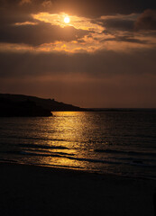 The sun setting over the headland off Saint Ives
