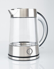 Modern electric kettle close up on a gray background