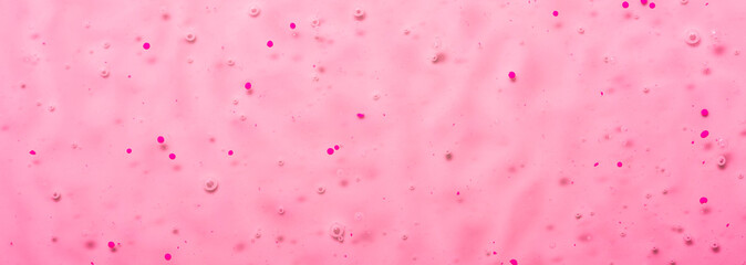 Cosmetic gel close-up with oxygen bubbles. Textured background with microbrushes in cosmetics....
