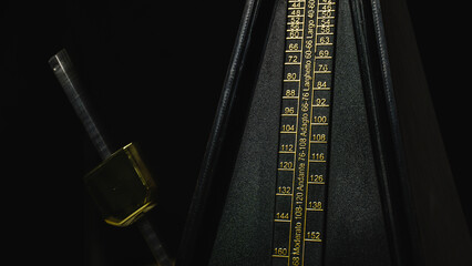 Mechanical metronome on a dark plain background: music, mechanical metronome, metronome, dark,...