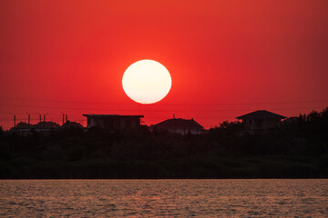 The sun goes down over a lake