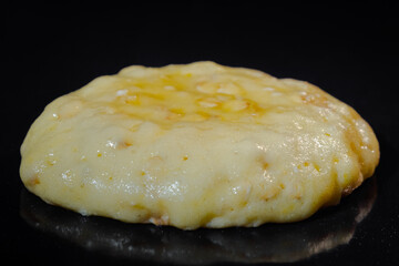 Cooking one homemade crunchy oatmeal cookie on metal sheet in oven - macro, close up view. Dessert,...