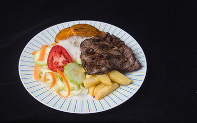 beef steak with fried bananas - peruvian food