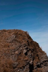 Road in mountains in autumn in sunny day