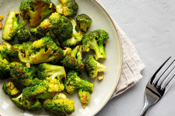 Homemade Pan-Fried Broccoli on a Plate, top view. Flat lay, overhead, from above. Close-up.