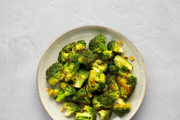 Homemade Pan-Fried Broccoli on a Plate, top view. Flat lay, overhead, from above. Copy space.